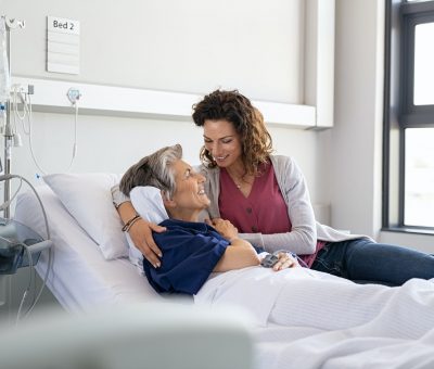 Daughter visiting mother in hospital